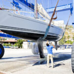 man cleaning and washing his boat getting it ready for storage